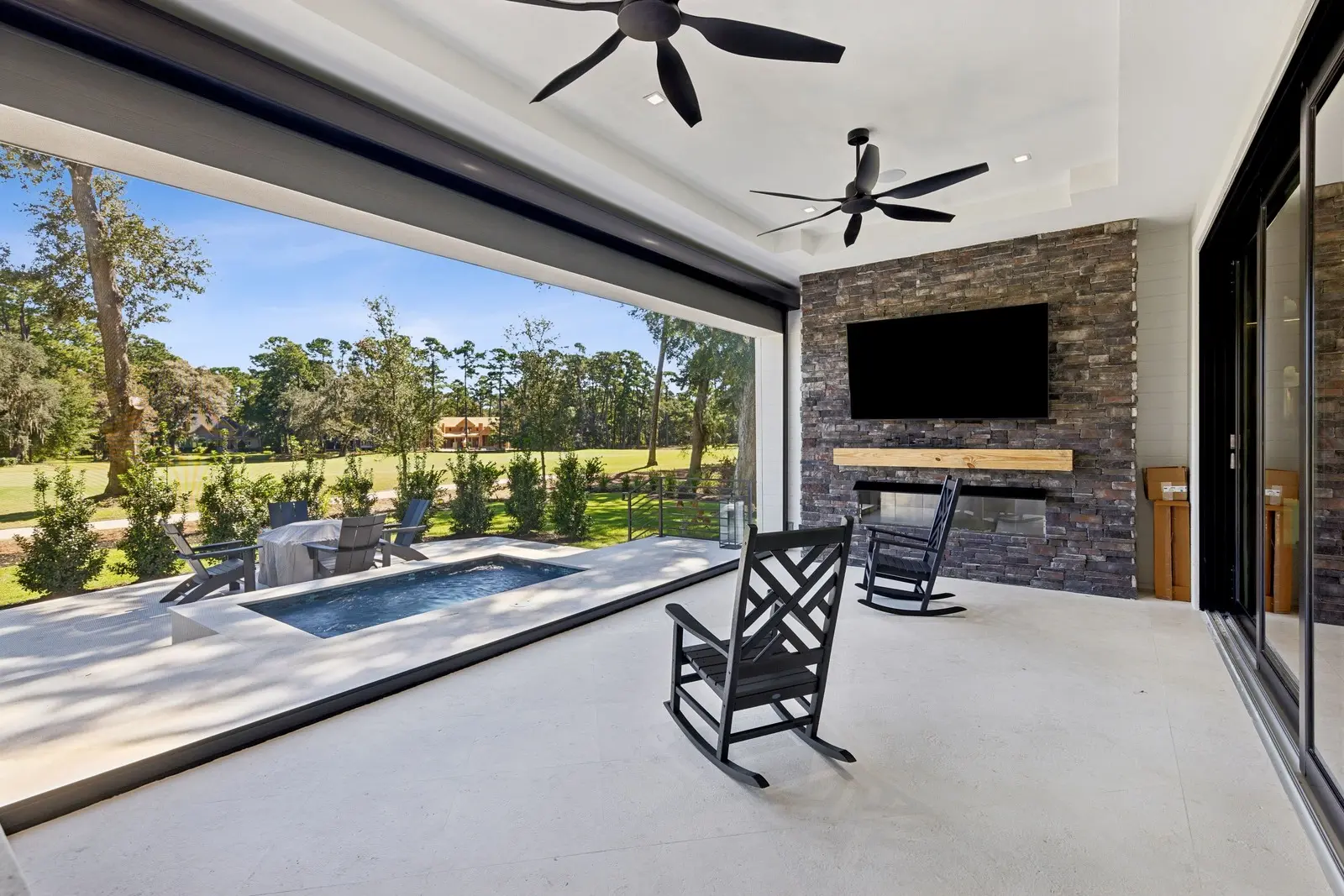 Timber & Tone completed residence exterior beneath mature oak trees