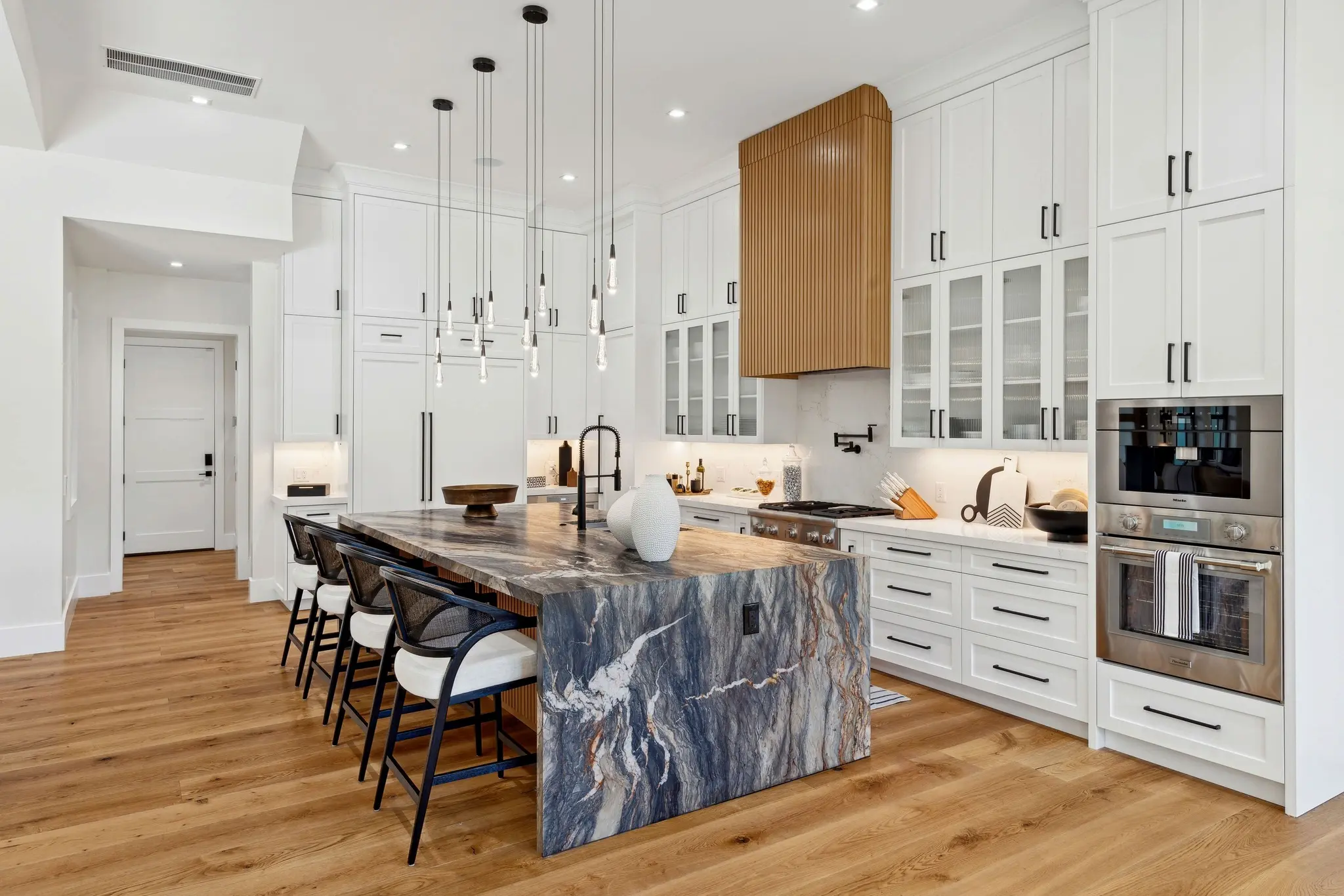 Timber & Tone completed kitchen with wine display and custom storage